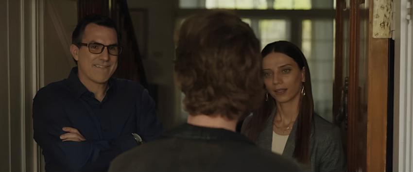 A House on the Bayou (1970) Movie scene: John (Paul Schneider) with his arms crossed, standing next to Sophie (Angela Sarafyan) as they answer the door to a guest