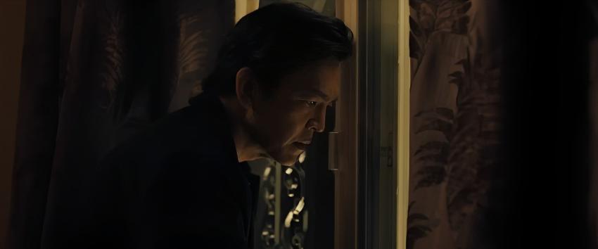 Afraid (1970) Movie scene: Curtis (John Cho) in a concentrated stare as he looks out of the window