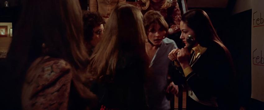 Black Christmas (1970) Movie scene: Jess (Olivia Hussey) answers the phone, surrounded by her sorority sisters