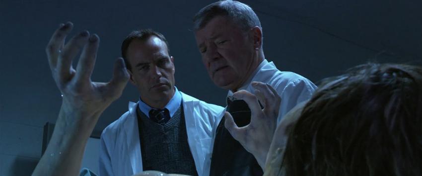 Decoys (1970) Movie scene: Detective Francis Kirk (Richard Burgi) examines the frozen body of a victim at the morgue during an investigation