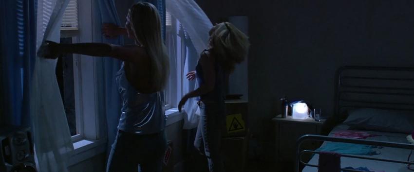 Decoys (1970) Movie scene: Lily (Stefanie von Pfetten) and Constance (Kim Poirier), the seductive aliens, cooling off by the open windows in their dorm room