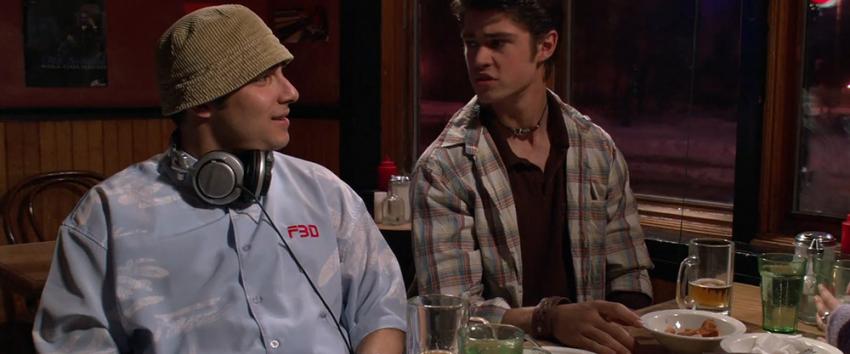 Decoys (1970) Movie scene: Roger (Elias Toufexis) and Luke (Corey Sevier) sitting at a restaurant/café, engaged in a conversation