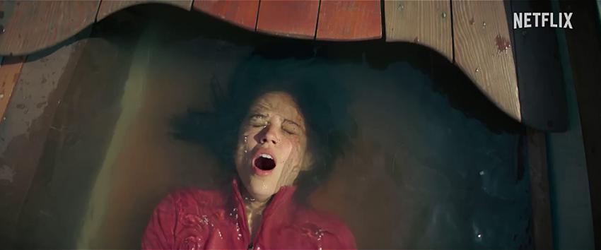 Don't Move (1970) Movie scene: Iris (Kelsey Asbille) sinking into a shallow amount water, preparing to hold her breath.