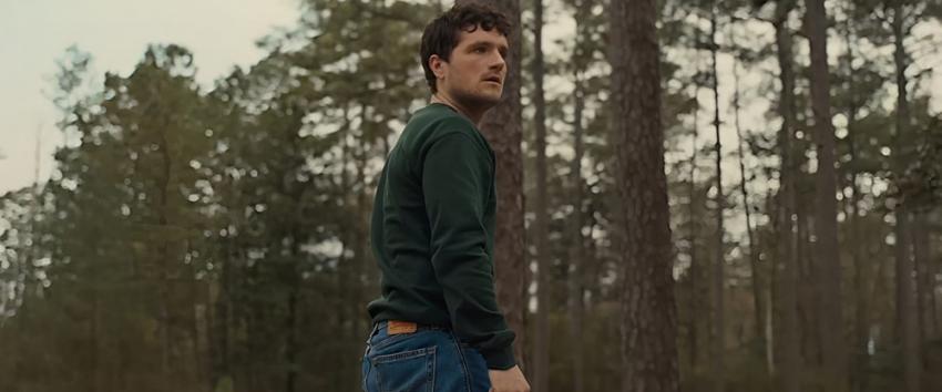 Five Nights at Freddy's (1970) Movie scene: Mike (Josh Hutcherson) standing in a forested area during daylight