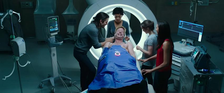 Flatliners (1970) Movie scene: Jamie (James Norton) laying down on the examination table during a flatline surrounded by Ray (Diego Luna), Sophia (Kiersey Clemons), Courtney (Elliot Page) and Marlo (Nina Dobrev)