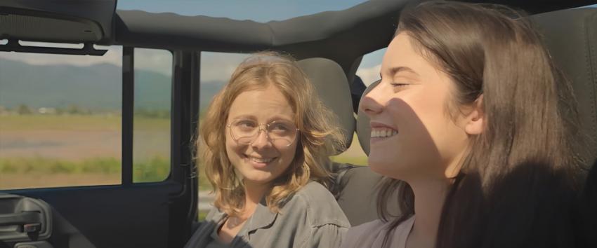 Gator Creek (1970) Movie scene: Kyle (Athena Strates) and Alice (Madalena Aragão) riding in the back of a jeep
