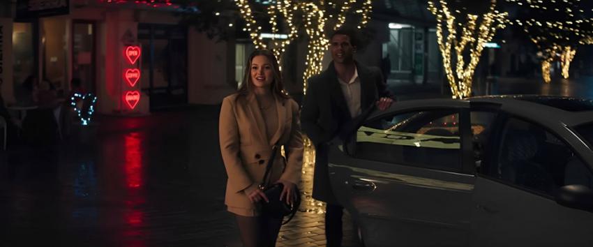 Heart Eyes (1970) Movie scene: Ally (Olivia Holt) and Jay (Mason Gooding) stand next to a car.