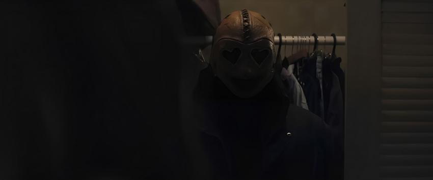 Heart Eyes (1970) Movie scene: The heart eyes killer standing in a closet.