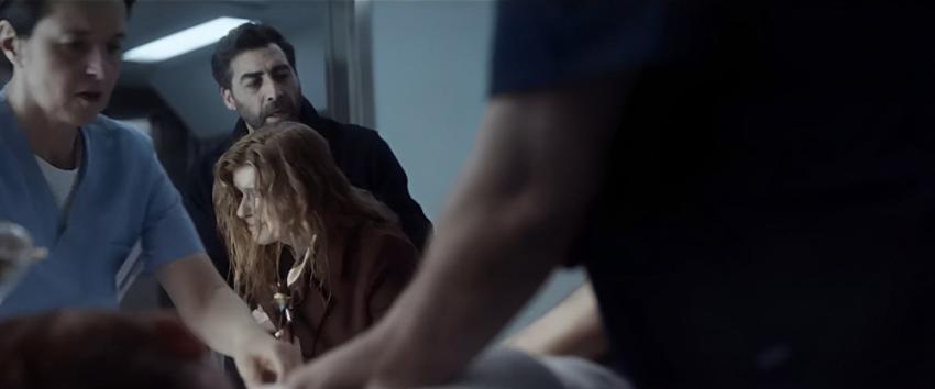 Here After (1970) Movie scene: Luca (Giovanni Cirfiera) tries to comfort a distraught Claire (Connie Britton) at the hospital