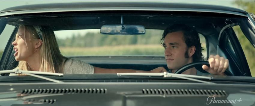 Pet Sematary: Bloodlines (1970) Movie scene: Norma (Natalie Alyn Lind) in the passenger seat of a car, expressing herself while Jude (Jackson White) drives.