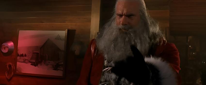 Santas Slay (1970) Movie scene: Santa (Bill Goldberg) staring in confusion while holding out his han