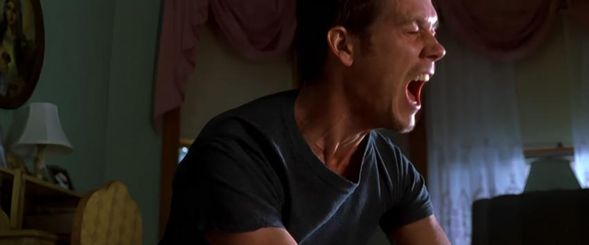 Stir of Echoes (1970) Movie scene: Tom (Kevin Bacon) wears a powerful, agonized expression.