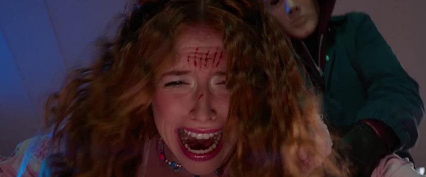 Time Cut (1970) Movie scene: A terrified woman with blood streaks on her forehead struggles as the masked Sweetly Slasher lunges at her from behind