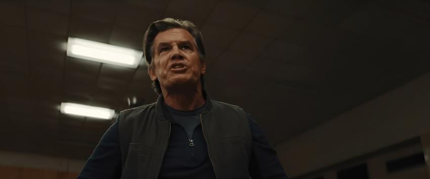 Weapons (1970) Movie scene: Archer (Josh Brolin) stands with a tense and emotional expression